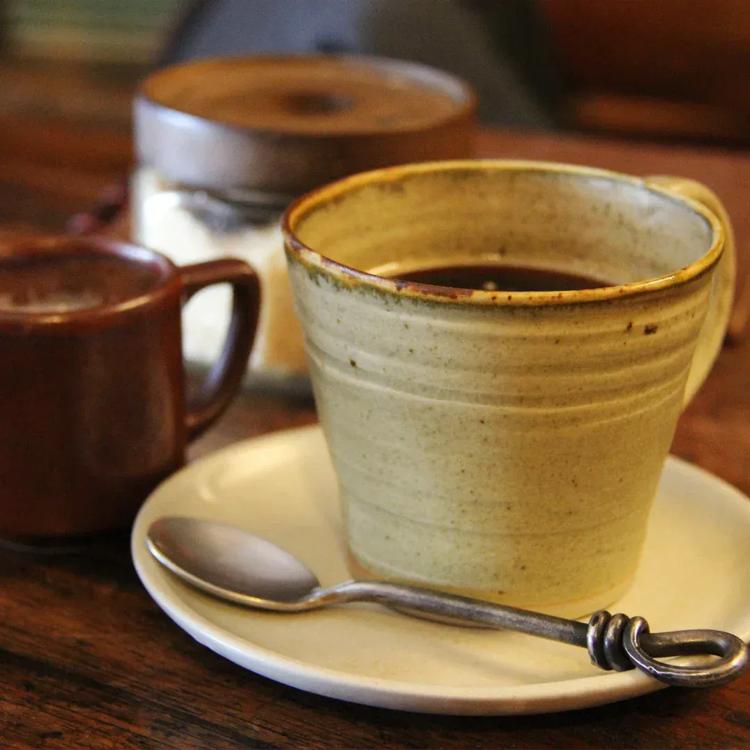 Three cups of coffee on a table.