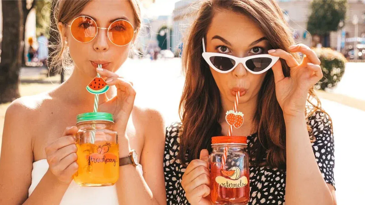 Women Drinking Lime And Lemon Water Mixes 