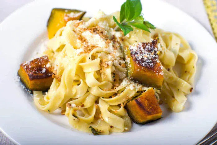 A bowl of True Lemon Fall Squash Baked Pappardelle.