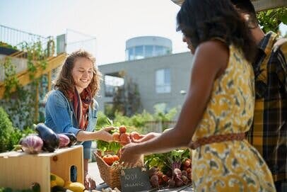 Woman purchasing food at farmers market