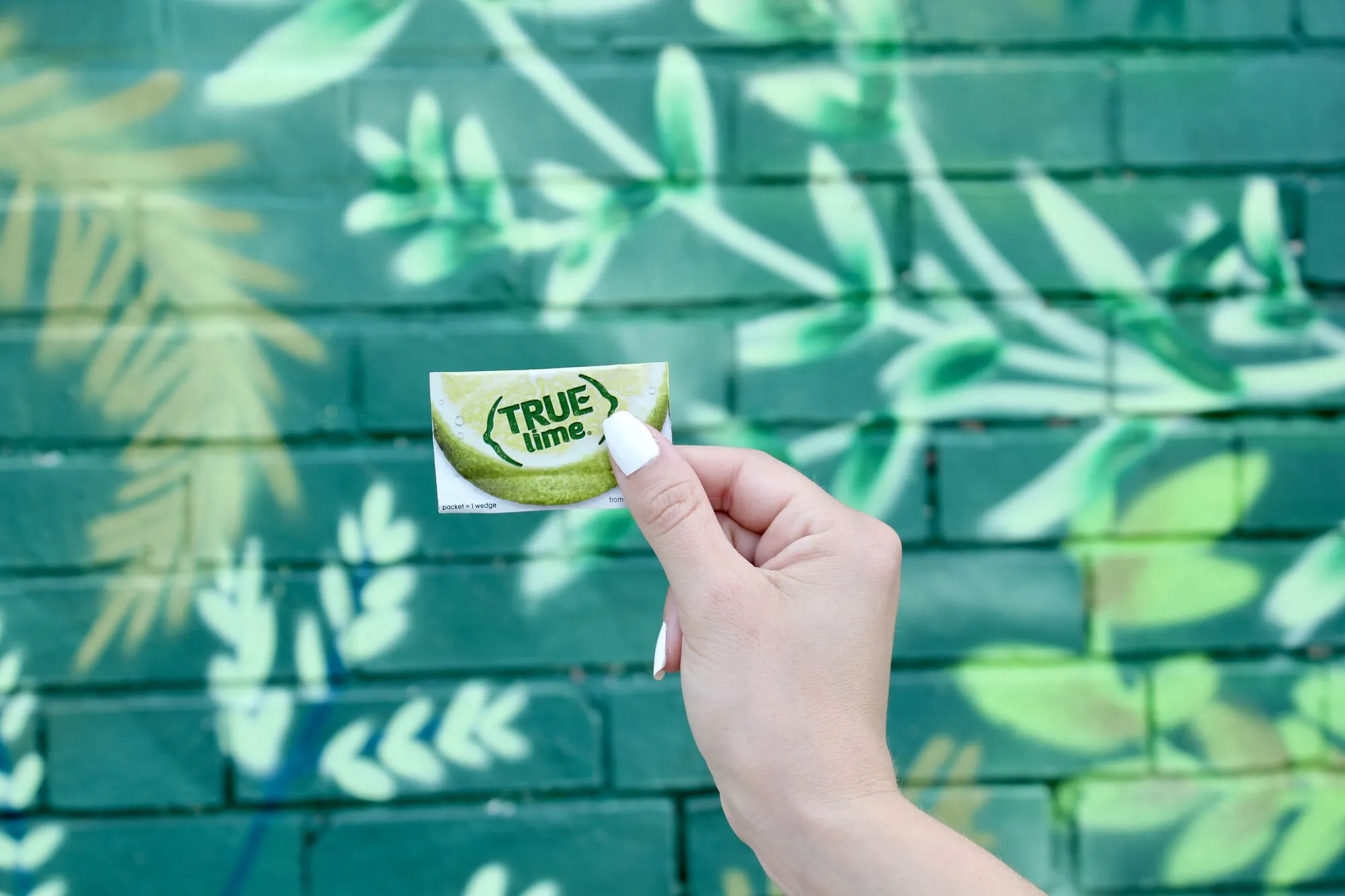 A graphic of a box of True Lime, True Lime Black Cherry Limeade, and True Lime Watermelon Limeade.