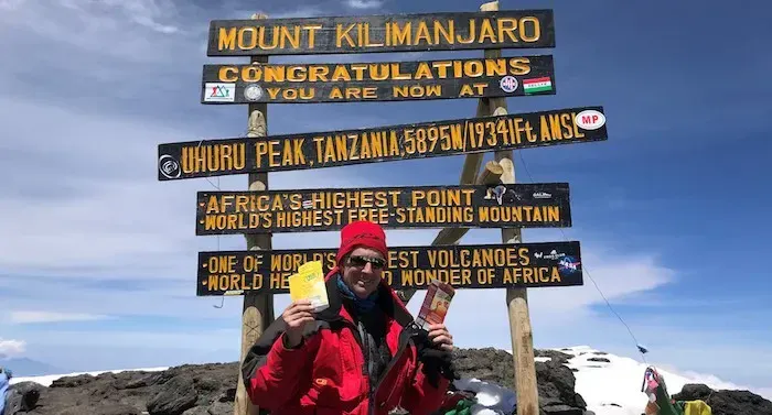 Photo of customer, Michael Persky, atop Mt. Kilimanjaro