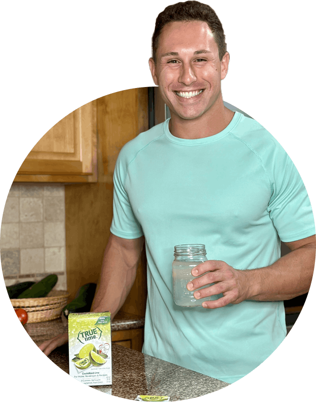 man smiling in his kitchen with True Lime