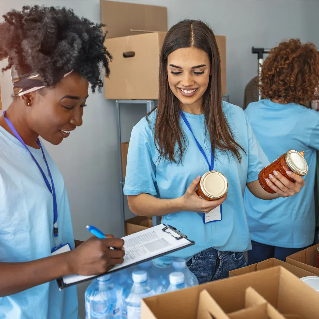 Three women volunteering.