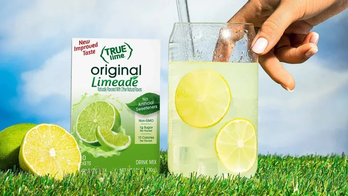 Person Holding A Glass Of Limeade-Flavored Water